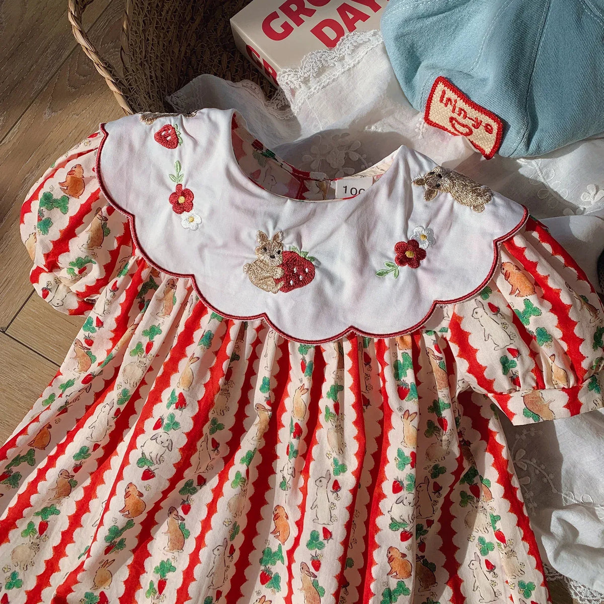Girls embroidered strawberry dress in red white cotton with scalloped collar and floral designs