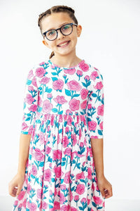 Girls floral pocket twirl dress in white with pink roses and green leaves, sleeves for ages 6-8