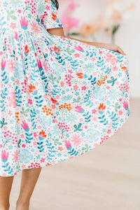 Girls floral twirl dress in white with colorful flowers, short sleeve pocket dress for toddlers
