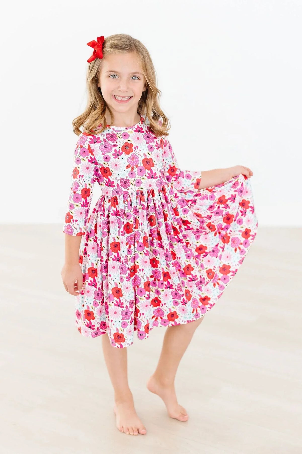 Girls floral twirl dress in pink and red with 3/4 sleeves for young girls by Mila & Rose