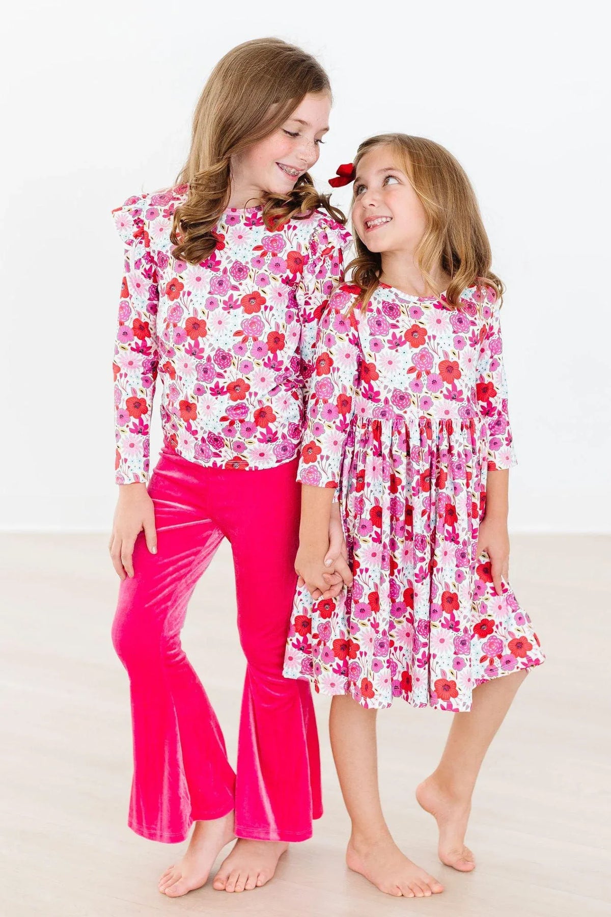 Girls floral twirl dress in white and pink with 3/4 sleeves, toddler size from Mila & Rose