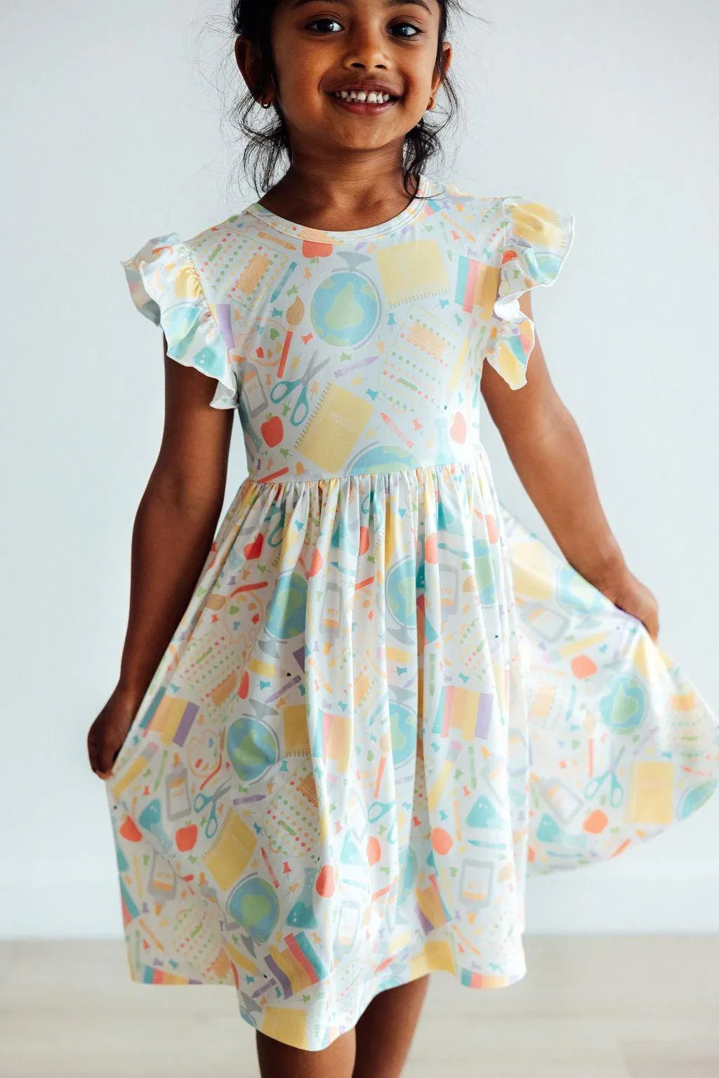 Girls size twirl dress flutter sleeve with colorful art supply pattern by Mila & Rose