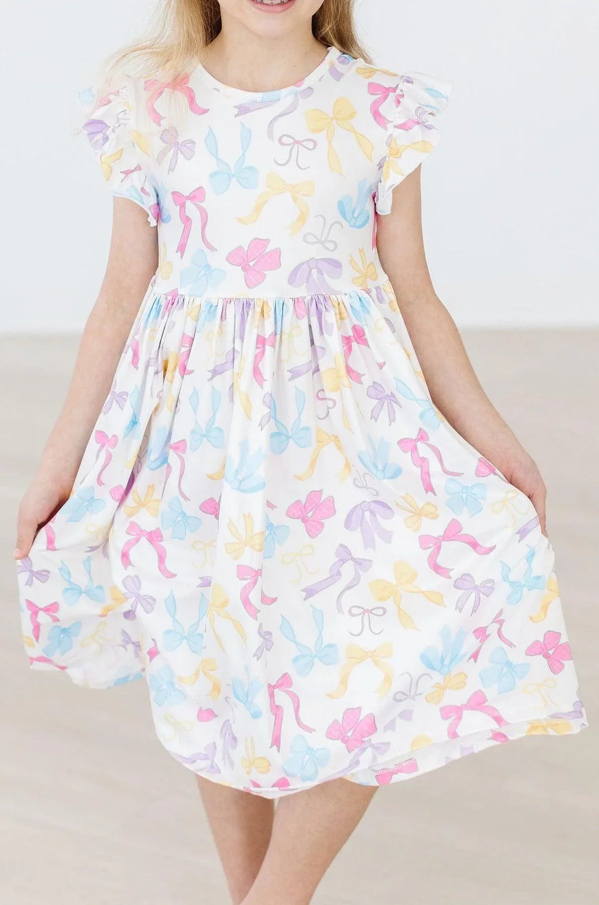 Girls white twirl dress flutter with colorful bow print and flutter sleeves for young girls