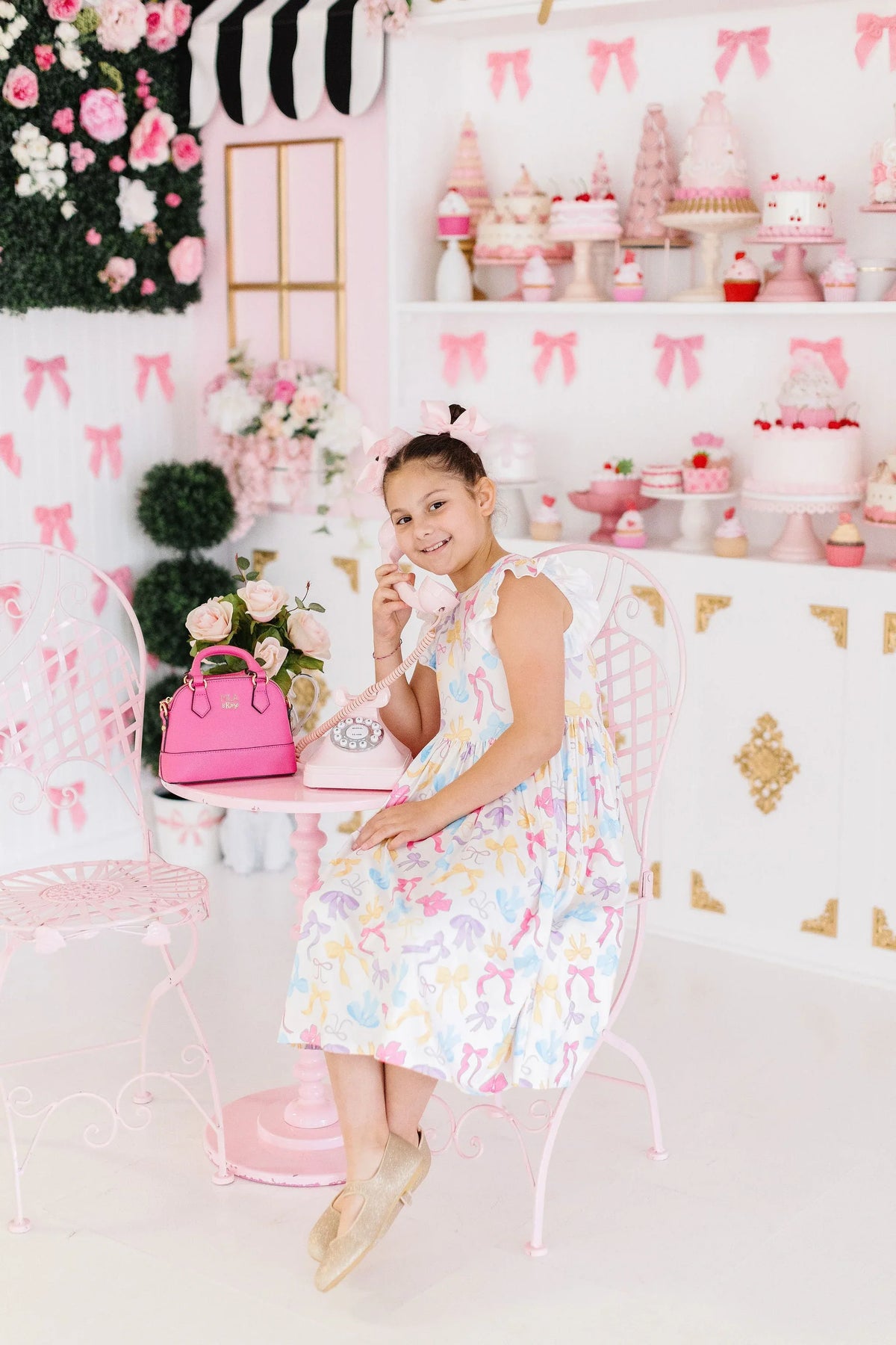 Girls pastel floral girls flutter sleeve twirl dress with ruffle sleeves worn by young girl