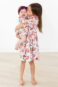Girls 3/4 sleeve white girls football floral twirl dress with pink and brown football and floral print