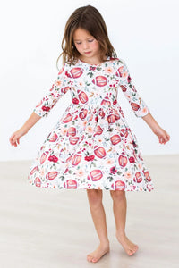 Girls white 3/4 sleeve twirl dress with football and floral print age 3 to 4 years