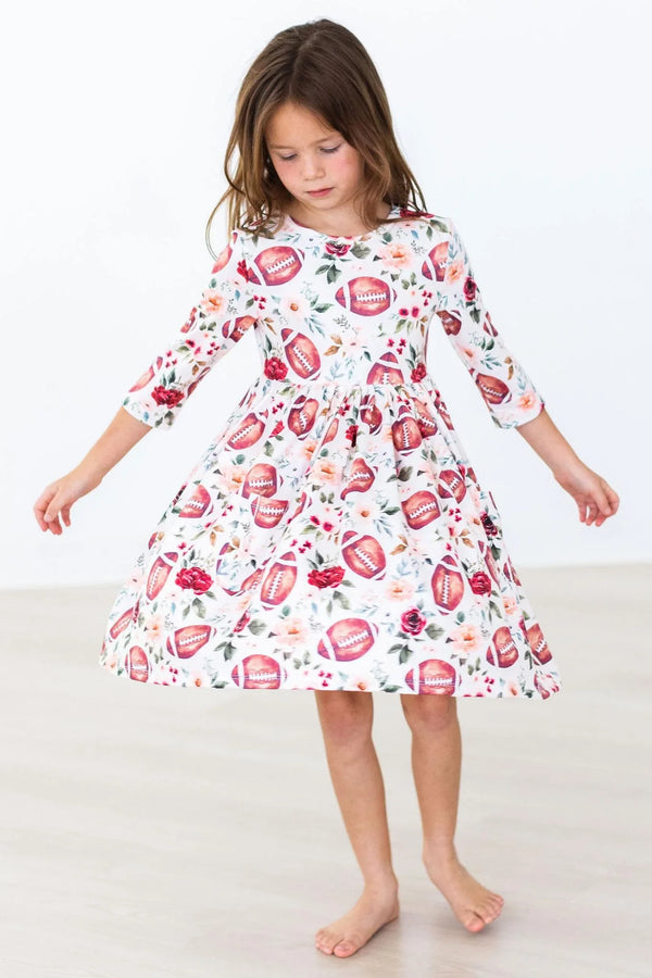 Girls white 3/4 sleeve twirl dress with football and floral print age 3 to 4 years