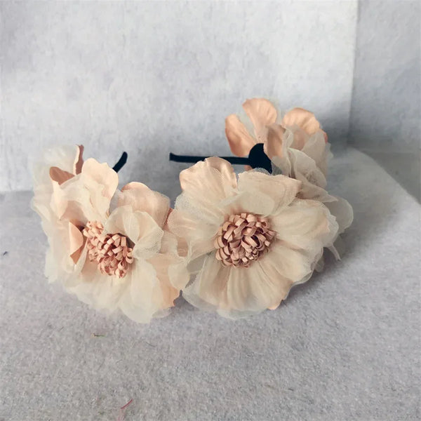 Girls headband with large soft peach and cream fabric flowers for babies and kids