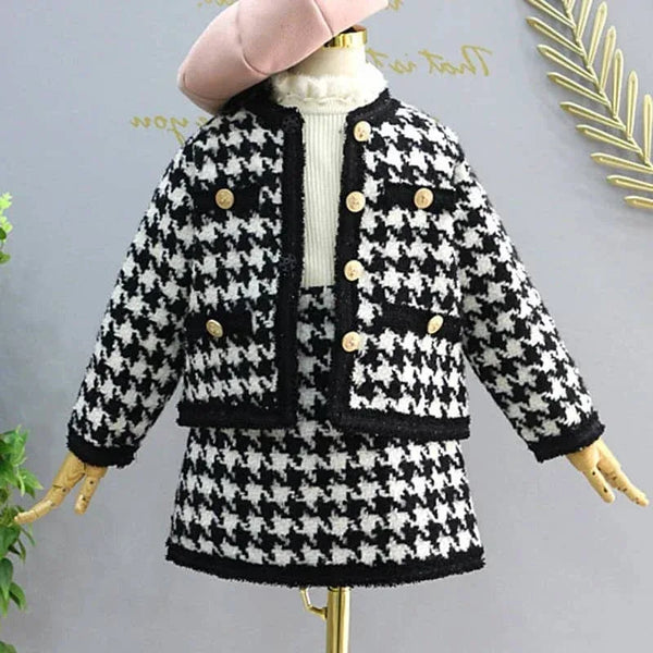 Black and white houndstooth girls knit skirt set for fall with gold buttons and soft wool material
