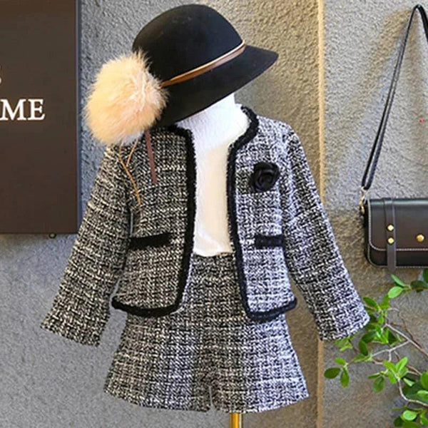 Black and white girls knit skirt set for fall with textured material, matching jacket, skirt, and white turtleneck