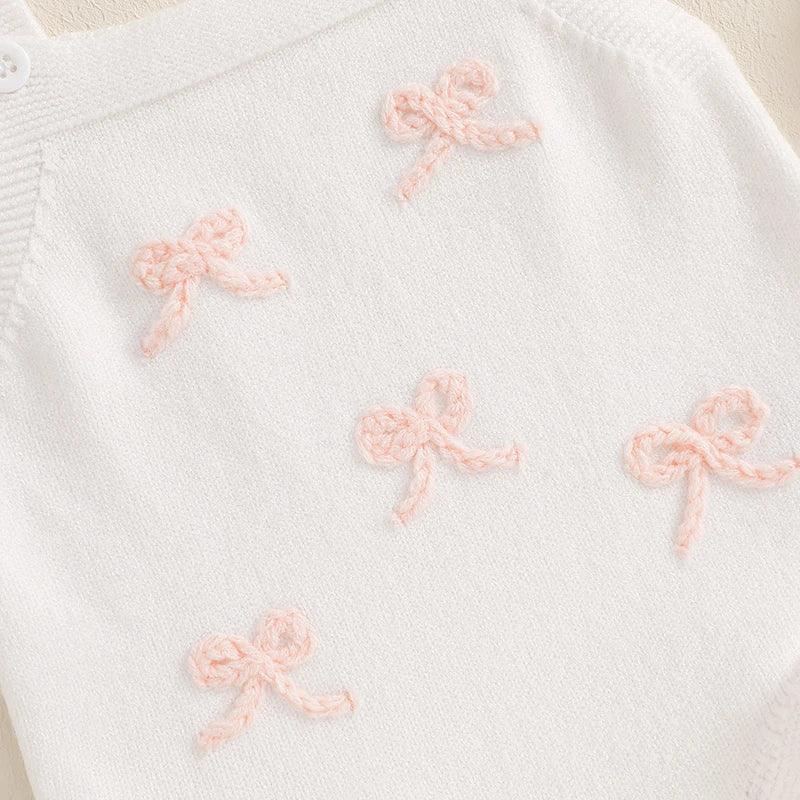 white girls knitted romper overalls with pink bow details for babies and kids