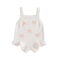 girls white knitted romper overalls with pink bow details, suitable for babies and toddlers