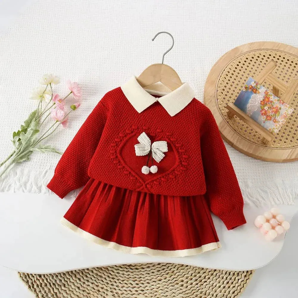 Red knitted skirt set for girls with white collar and bow detail, suitable for toddlers and young girls