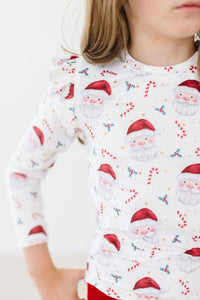 Girls white mistletoe ruffle tee long sleeve with red Santa Claus and candy cane print, toddler size