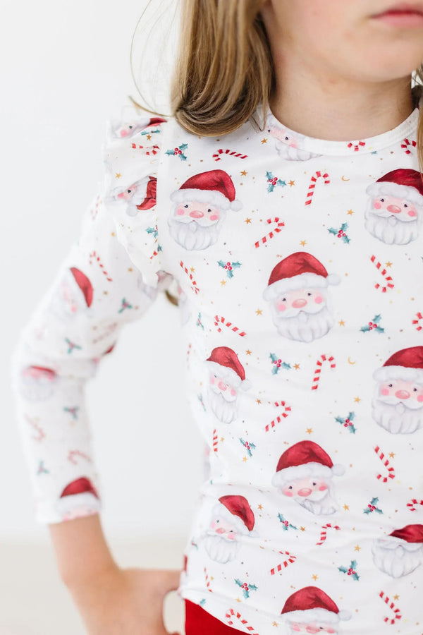 Girls white mistletoe ruffle tee long sleeve with red Santa Claus and candy cane print, toddler size