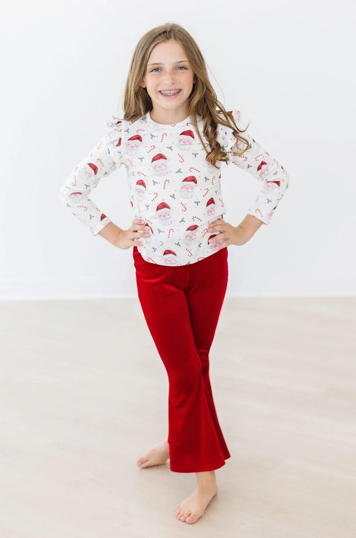 Girls size long sleeve white girls mistletoe ruffle tee with red holiday print and ruffle shoulder detail