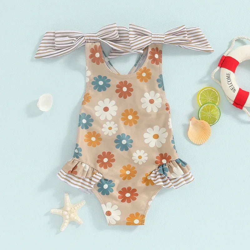 Girls one piece swimsuit with multicolor floral print and striped bow straps for toddlers