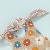 Girls one piece swimsuit beige with multicolor flower print and striped bow straps for toddlers