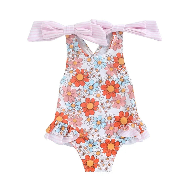 girls one piece swimsuit with floral print in orange blue and pink with pink bow straps for toddlers
