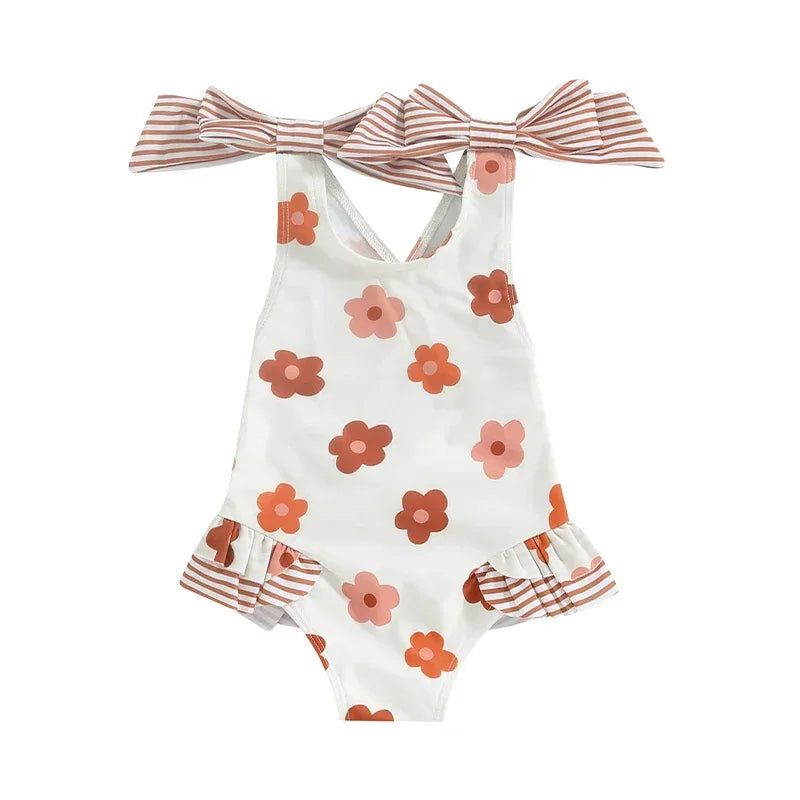 girls one piece swimsuit white with brown and pink floral print and striped bow shoulder straps
