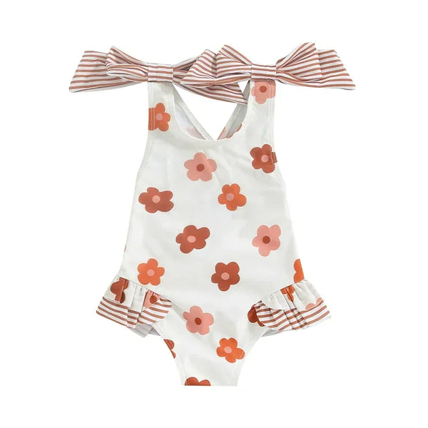 girls one piece swimsuit white with brown and pink floral print and striped bow shoulder straps