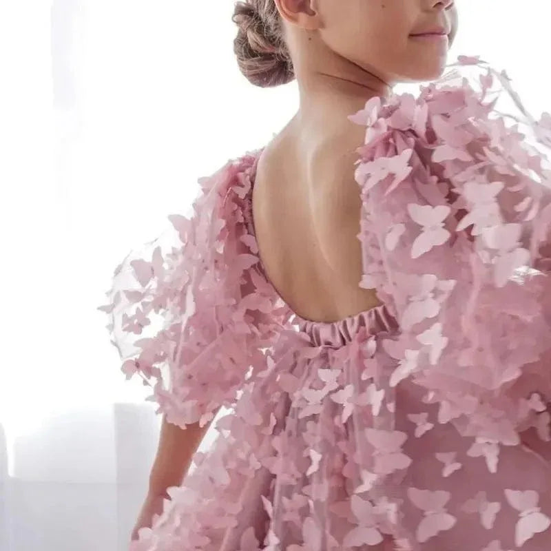 Girls pink party dress with 3D butterfly appliques and puff sleeves for young children