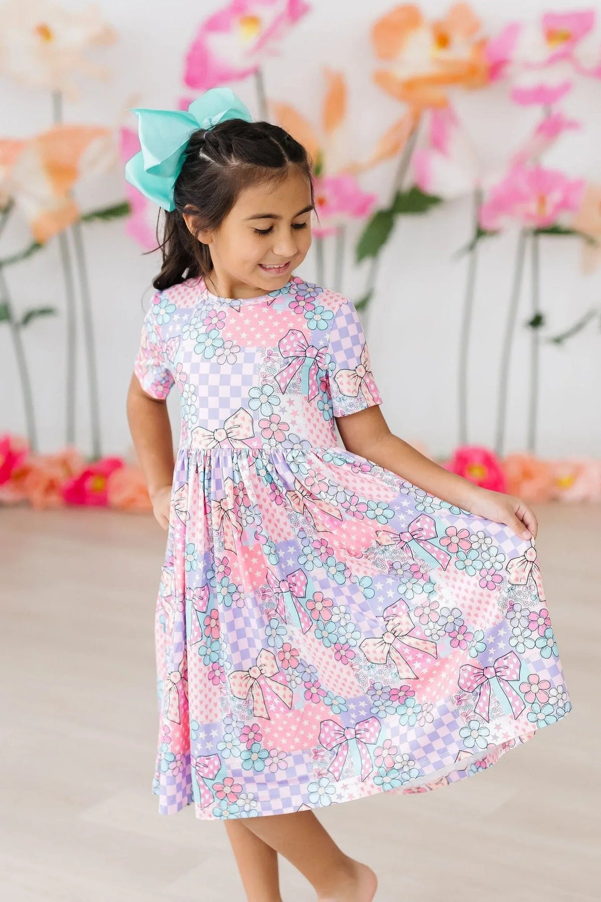girls patchwork princess twirl dress in pastel pink and purple with bow and floral print for young girls