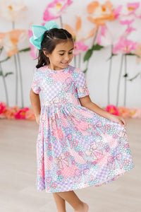 girls patchwork princess twirl dress in pastel pink and purple with bow and floral print for young girls