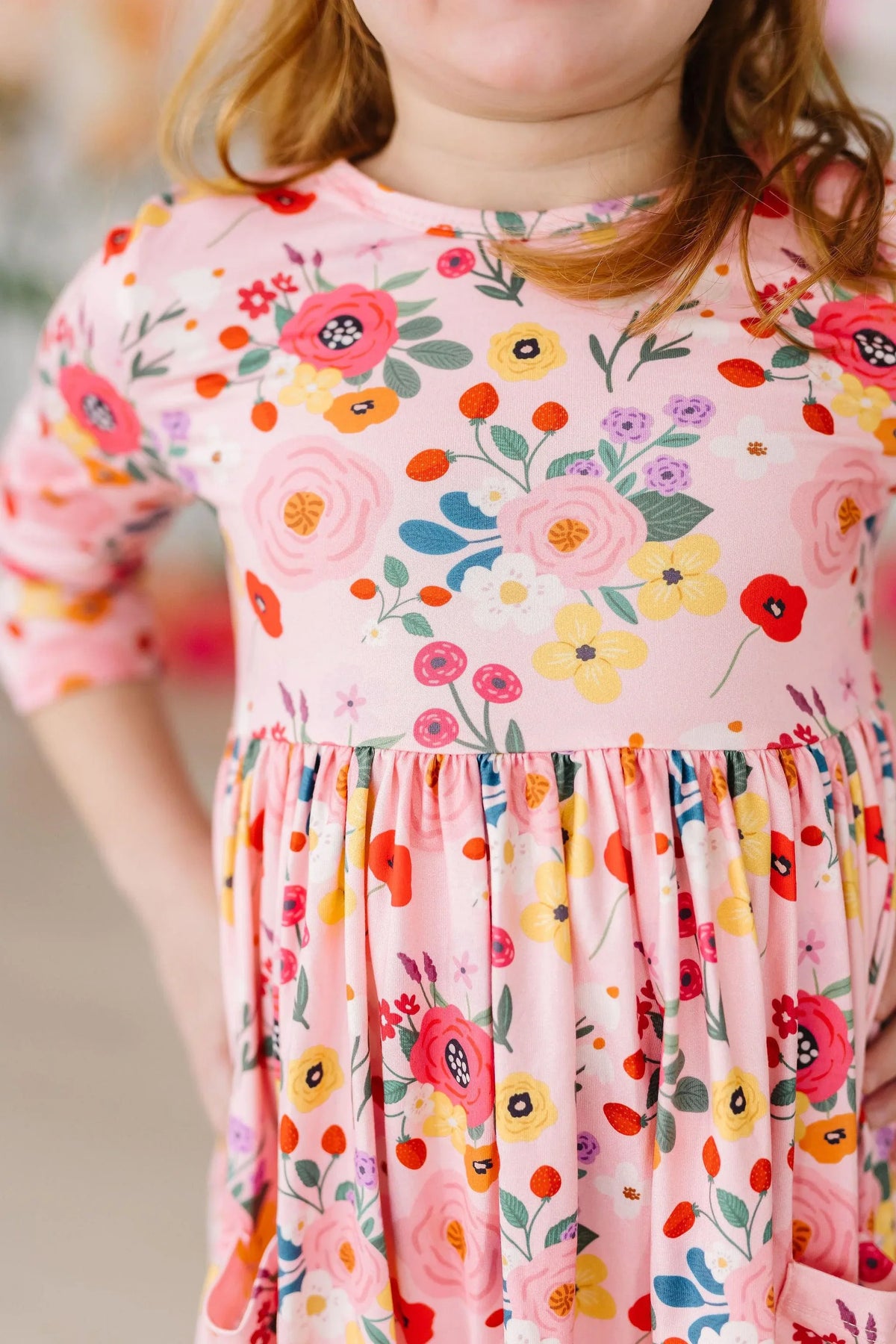 Girls pink floral twirl dress with 3/4 sleeve in colorful flower print for young girls