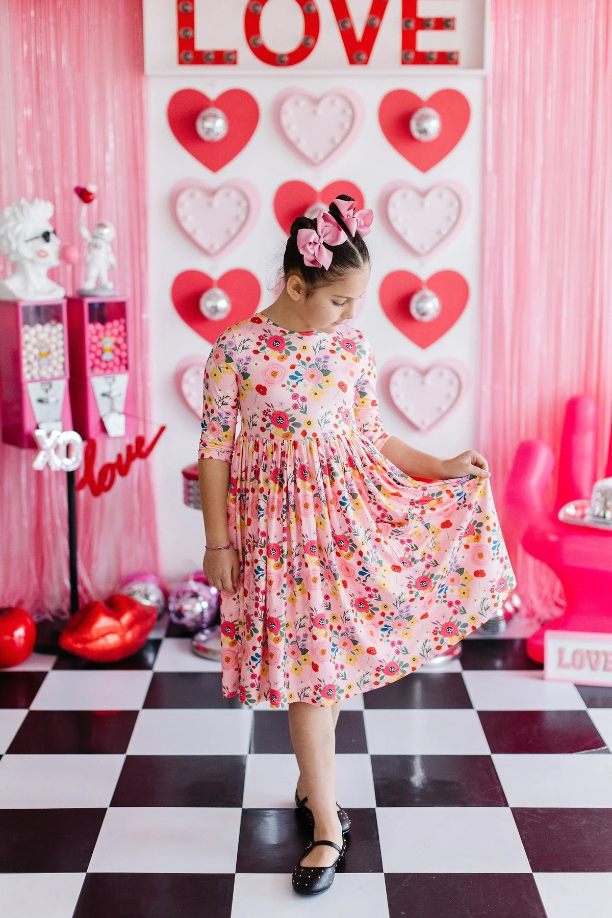 Girls pink floral twirl dress by Mila & Rose, 3/4 sleeve, knee-length with colorful flower print