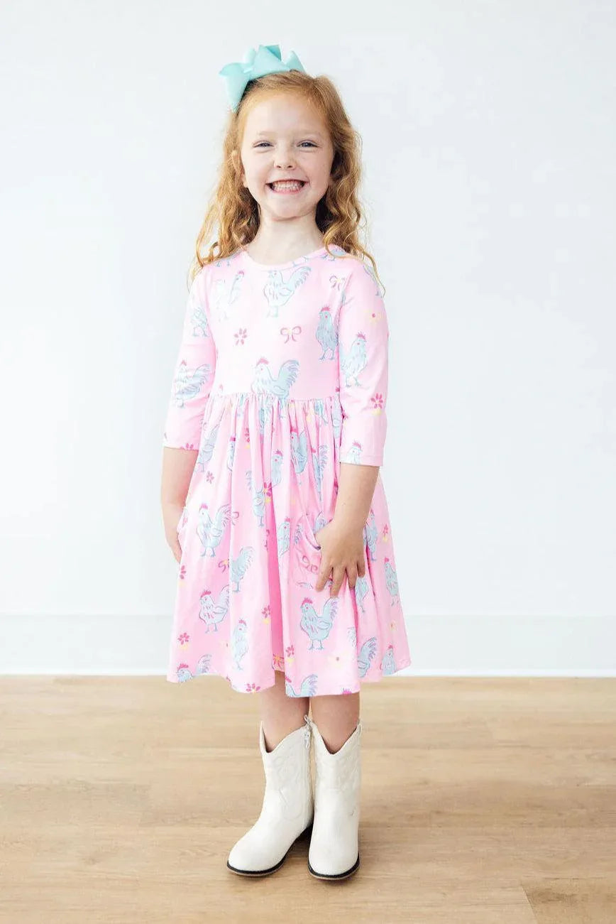 Girls pink twirl dress with pocket, 3/4 sleeve, toddler size featuring unicorn print
