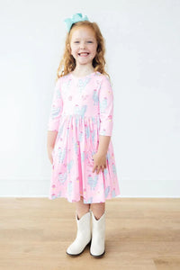 Girls pink twirl dress with pocket, 3/4 sleeve, toddler size featuring unicorn print