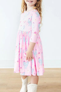 Girls pink twirl dress by Mila & Rose with 3/4 sleeves and rooster print in toddler size