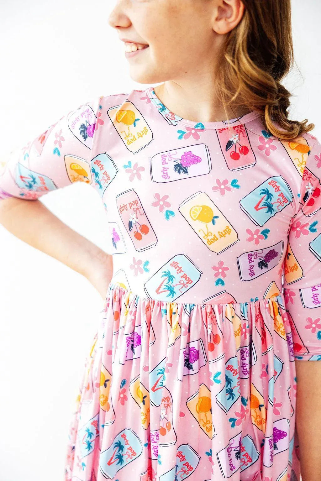 Girls pink twirl dress with 3/4 sleeves featuring colorful fruit jar print for kids