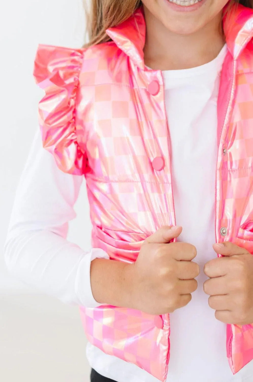 Girls pink checkerboard puffer vest with ruffle shoulder detail in size small