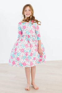 Girls retro floral twirl dress in pastel pink and blue with 3 quarter sleeves for young girls