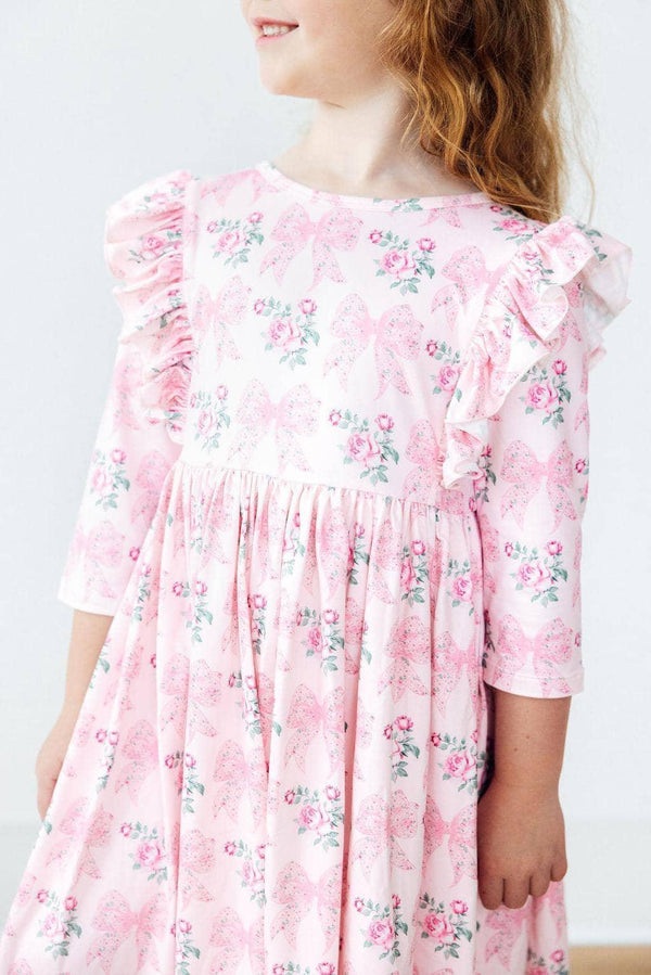 Girls pink floral girls ruffle twirl dress with 3/4 sleeves and shoulder ruffles