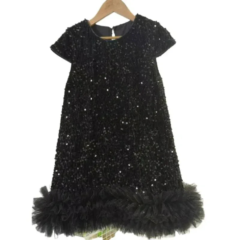 black girls sequined party dress with short sleeves and ruffled hem for toddlers hanging on wooden hanger