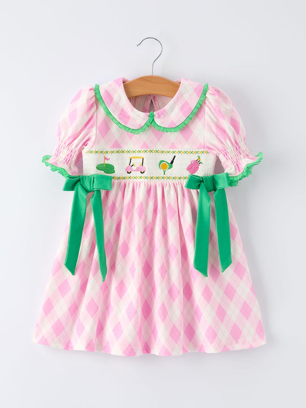 Pink and white plaid girls smocked golf dress with green collar and bows for toddlers