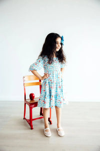 Girls blue floral girls smocked ruffle dress with puff sleeves age 6-8