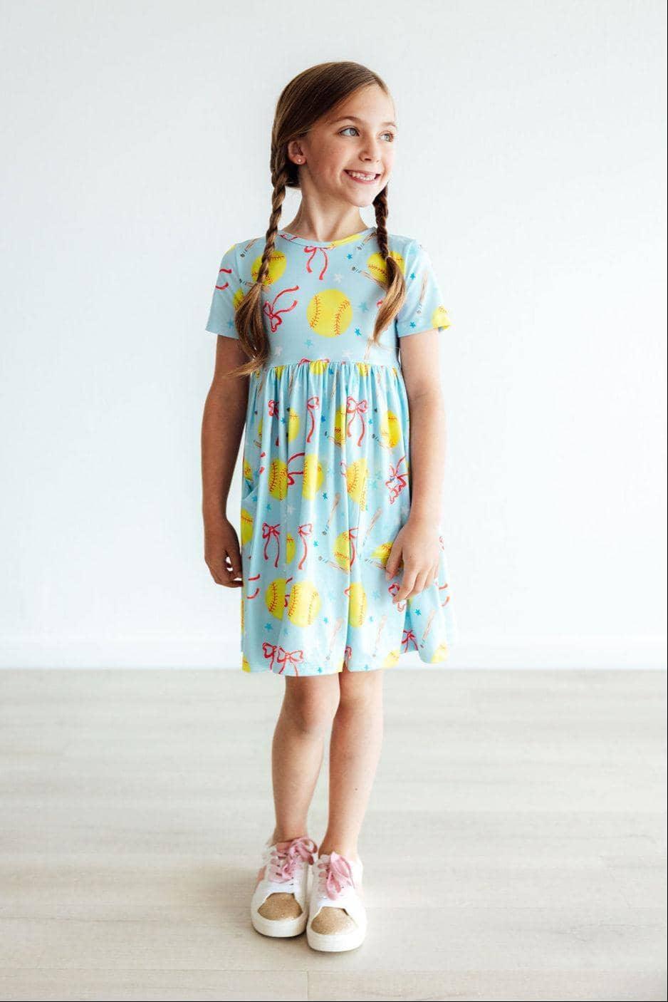 Girls light blue twirl pocket dress with yellow softball print short sleeve girls softball dress