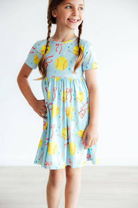 Girls light blue twirl pocket dress with yellow softball print, short sleeve girls softball dress for ages 6-8