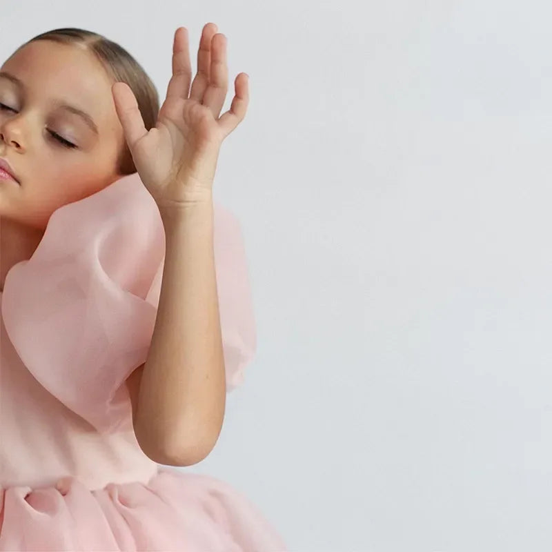 Girls pink special occasion dress with large puff sleeves for young children