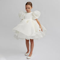 Girls white special occasion dress with puff sleeves and layered skirt for young girls