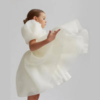girls special occasion dress in white with puff sleeves and flowing skirt for toddlers
