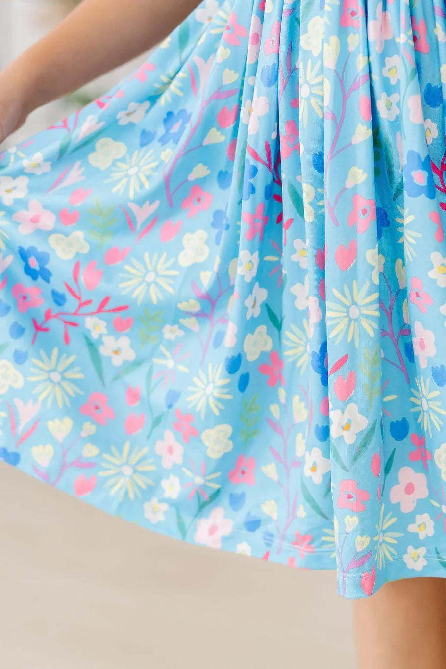 Girls blue floral twirl dress in spring colors with lightweight fabric for Mila & Rose, girls spring twirl dress