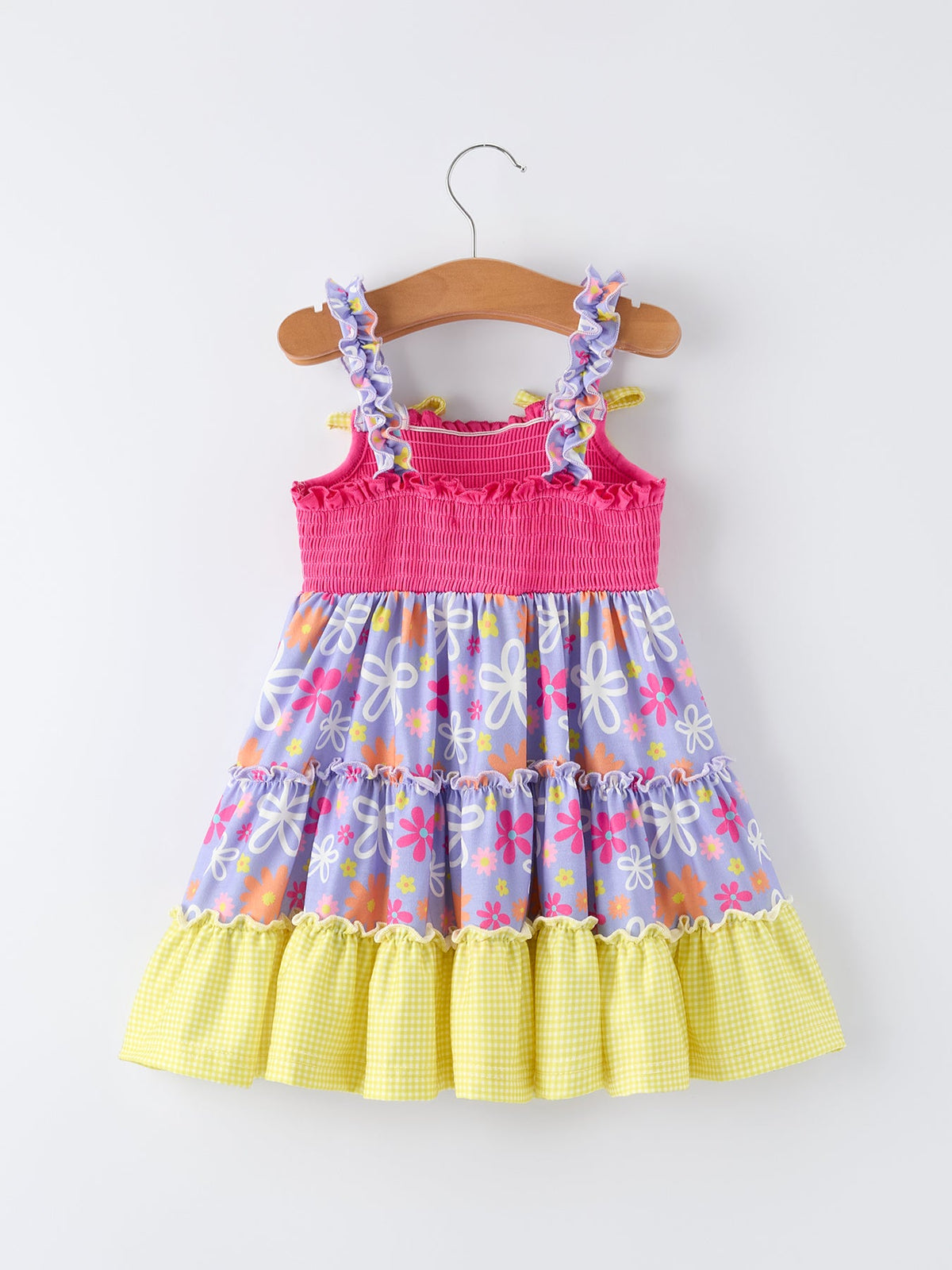 Rylee Faith Designs girls summer floral smocked dress with pink top and purple floral skirt with yellow ruffle hem