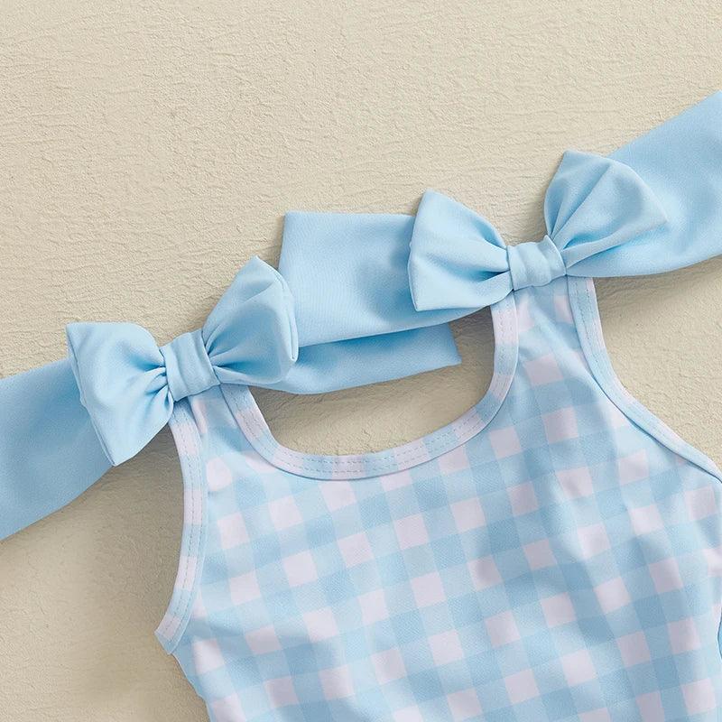 Light blue and white gingham girls swimsuit with large shoulder bows for toddlers