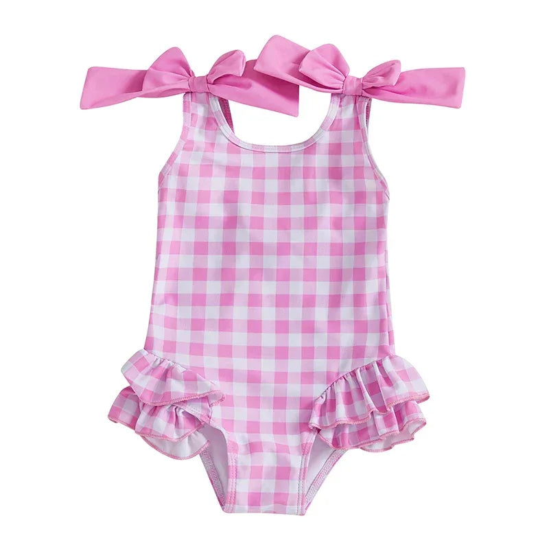 girls pink gingham swimsuit with shoulder bows and ruffle skirt for toddlers