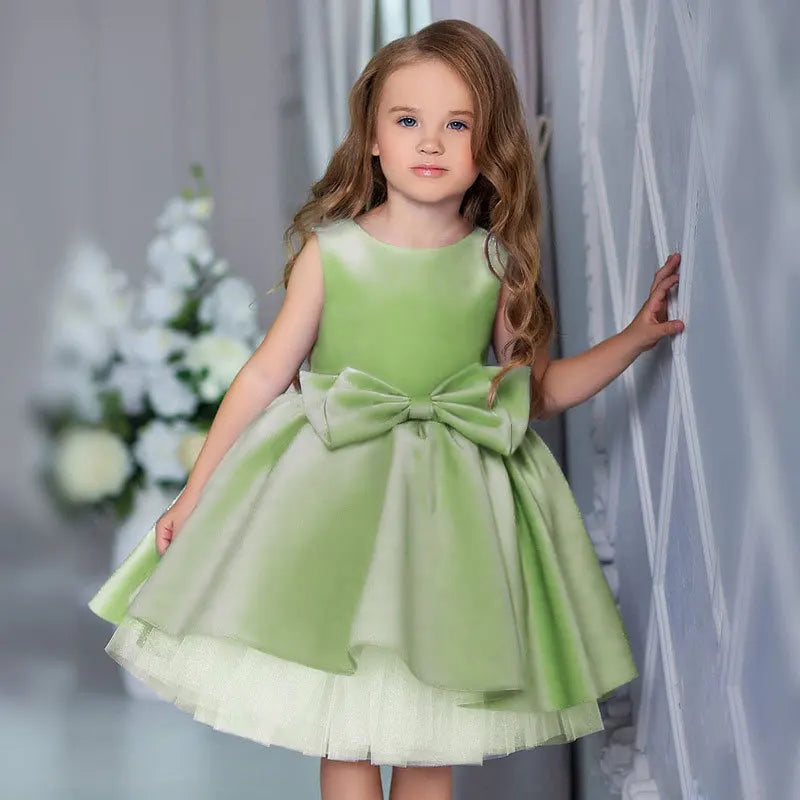 Girls tiered party dress in light green with large bow detail for toddler sizes